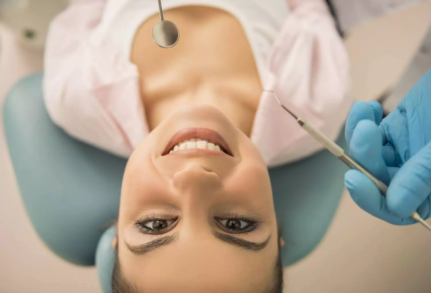 A patient attending a dental implant consultation with a certified implantologist, reviewing 3D imaging and digital scans to discuss bone grafting needs, implant placement strategy, recovery timeline, and the long-term benefits of titanium implants over traditional dentures for durability and improved oral function.